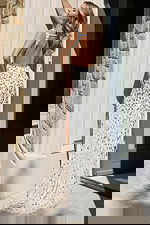 White sequin gown with mirror embellishments and side slit