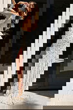 Glamorous high-slit gown covered in bold pink sequins