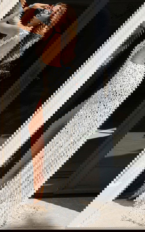 Glamorous high-slit gown covered in bold pink sequins