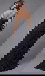 Back view of strapless ruched gown with beaded neckline detail and layered side ruffle train