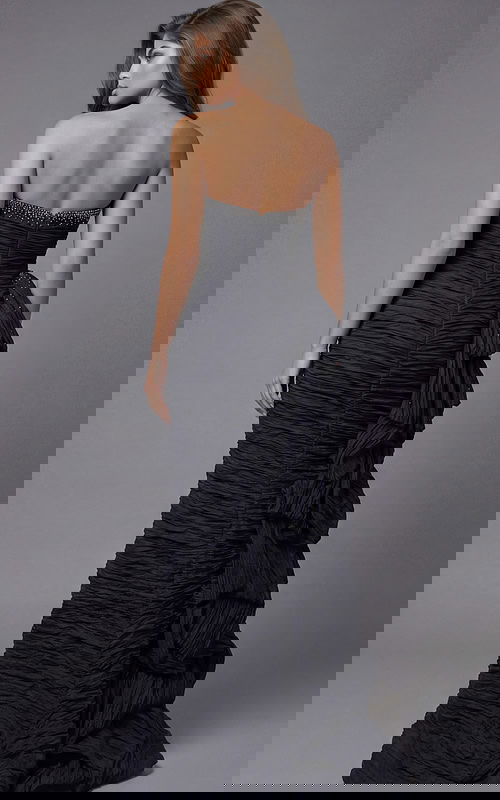 Back view of strapless ruched gown with beaded neckline detail and layered side ruffle train