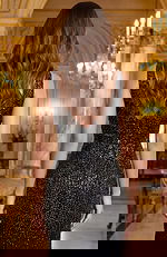 Back view of sleeveless beaded gown with V shaped back and smooth fit