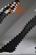 Model wearing Jovani 43760 black lace mermaid gown with sweetheart neckline, front view.