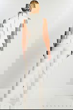 Back View Of Ivory Button-Up Pant Suit Featuring Long Zipper And Fitted Waist