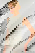 Side View Of Ivory Peplum Pant Suit With Pointed Collar And Sleek Silhouette