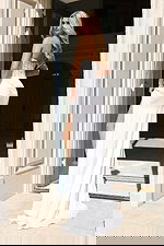 Back view of sequin bodice gown with flowing skirt