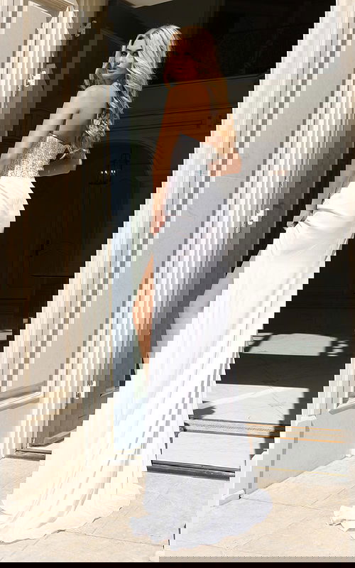 Back view of sequin bodice gown with flowing skirt