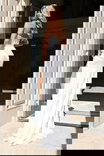 Elegant strapless evening dress with side slit and fitted waist