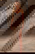 Elegant fitted gown with sheer illusion bodice, intricate beadwork, and a thigh high slit showcasing a sleek silhouette