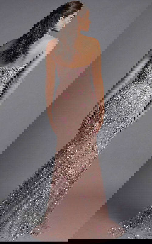 Floor length formal gown with intricate beadwork and body contouring design