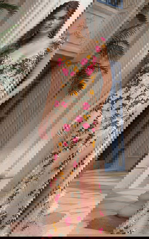 Fitted prom gown featuring embroidered floral details, sheer illusion fabric, and a high slit with sculpted waist shaping