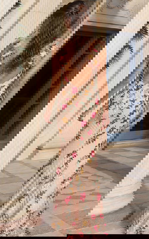 Long embellished prom dress with floral appliqué beading, sheer overlay, and a sleek body hugging silhouette