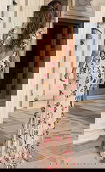 Long embellished prom dress with floral appliqué beading, sheer overlay, and a sleek body hugging silhouette