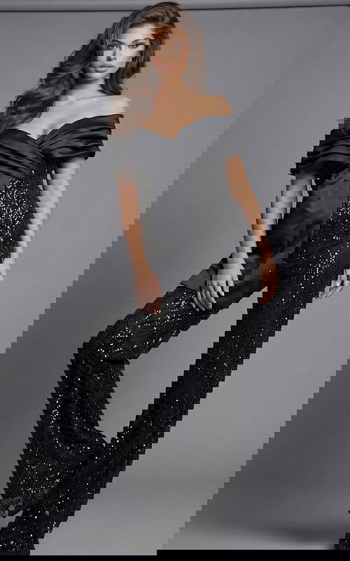 Front view of beaded wide leg jumpsuit with off shoulder draped neckline, fitted waist, and flowing pant