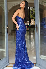 Back view of fitted sequin gown with sheer bodice and flowing train