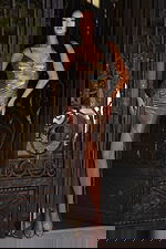 Metallic formal gown with V neckline and thigh-high slit