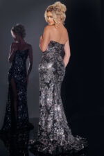 Model wearing Jovani 44116, a dazzling black gown with sequin embellishments, back view.