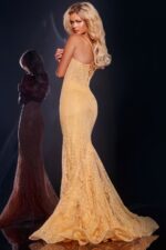 Model wearing Jovani 44142 beige mermaid gown back view with lace-up detail