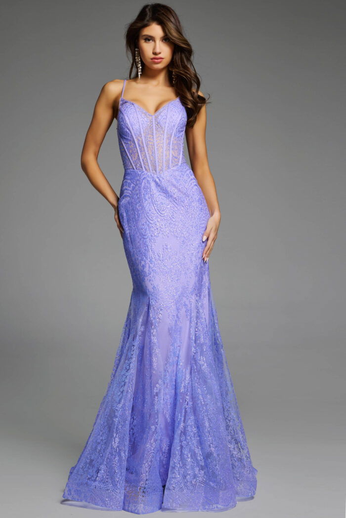 Full-length dress with intricate lace patterns and spaghetti straps.