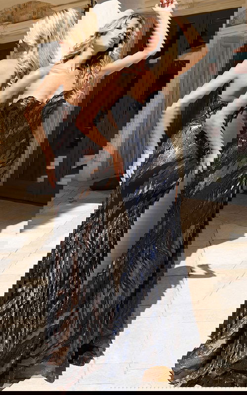 Shimmering black evening dress with sculpted silhouette