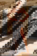 Elegant fitted gown with high slit and shimmer details