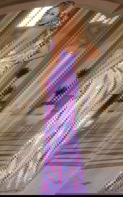 Model showcasing the back of Jovani 44220 lilac gown with shimmering sequins.