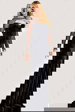 Black velvet gown with crystal-embellished sheer sleeves, a sweetheart neckline with keyhole detail, and a thigh-high slit for an elegant evening look.