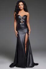 Model wearing Jovani 44295 black gown, front view with sweetheart neckline and high slit.