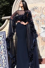 Elegant long navy gown featuring 3D floral trim on cape