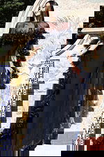 Navy fitted gown with sheer floral embellished cape