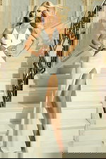 Model wearing halter gown with plunging neckline and beaded waist