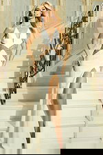 Front view of high slit evening gown with embellished waistline