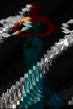 Fitted metallic gown featuring sweetheart neckline and flared hem