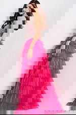 Bright pink strapless tiered prom dress with sparkle bodice