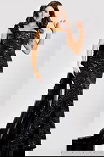 One shoulder sequin gown featuring a fitted silhouette, floral appliqué strap, and cascading sheer train for a glamorous evening look.