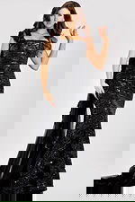 One shoulder sequin gown featuring a fitted silhouette, floral appliqué strap, and cascading sheer train for a glamorous evening look.