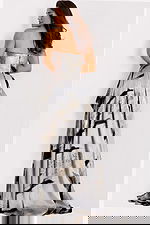 Formal gown with bold brushstroke patterns and structured silhouette