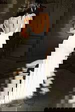 Chic floor-length dress styled with shimmering accessories and slits