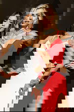 Fitted evening dress featuring jeweled cuffs and strappy shoulders