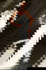 Sleek V-neck gown with embellished choker and high slit detail