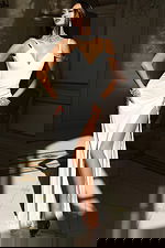 Elegant open-back gown with crystal neckline and floor-length skirt