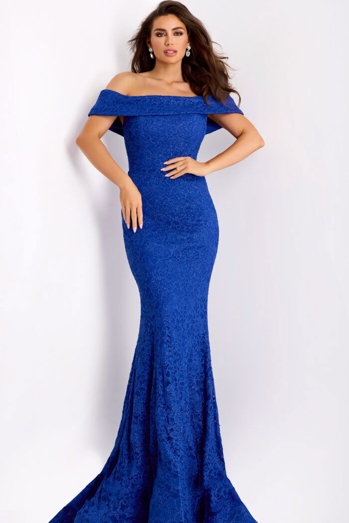 Front view of fitted formal lace gown with ruffle neckline