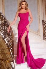 Model wearing Jovani 44427, a fuchsia sparkling gown with a scoop neckline and high slit.