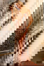 Liquid blush gown with corset bodice and high slit