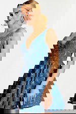 Angled view showing V-neckline and flared skirt with sequin floral details