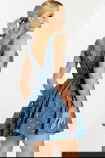 Side-back angle highlighting the flare and structure of the embroidered skirt