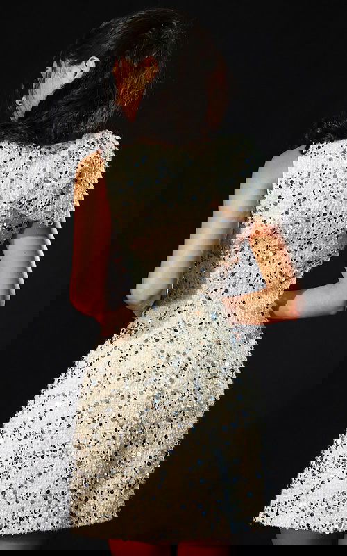 Short ivory sequin short dress with structured shoulder detail and fitted bodice