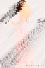 Pink sweetheart gown with keyhole bodice and flowy layers