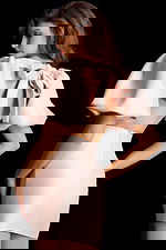 Short blush satin dress with puff sleeves and fitted silhouette