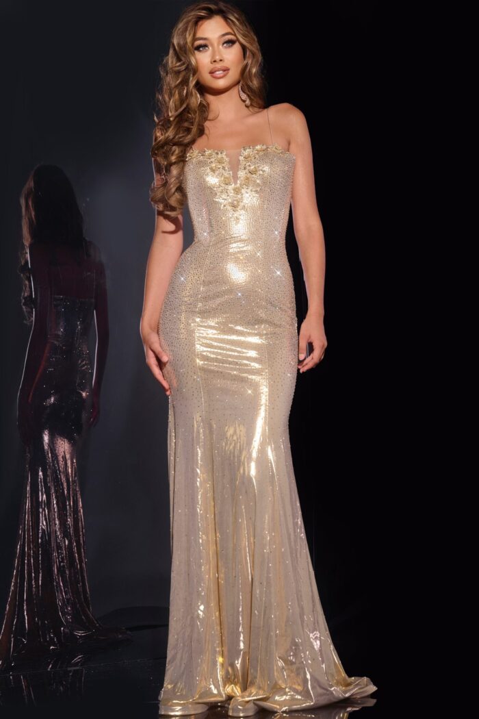 Model wearing Jovani 44539 gold gown with floral appliqués and deep V-neckline.